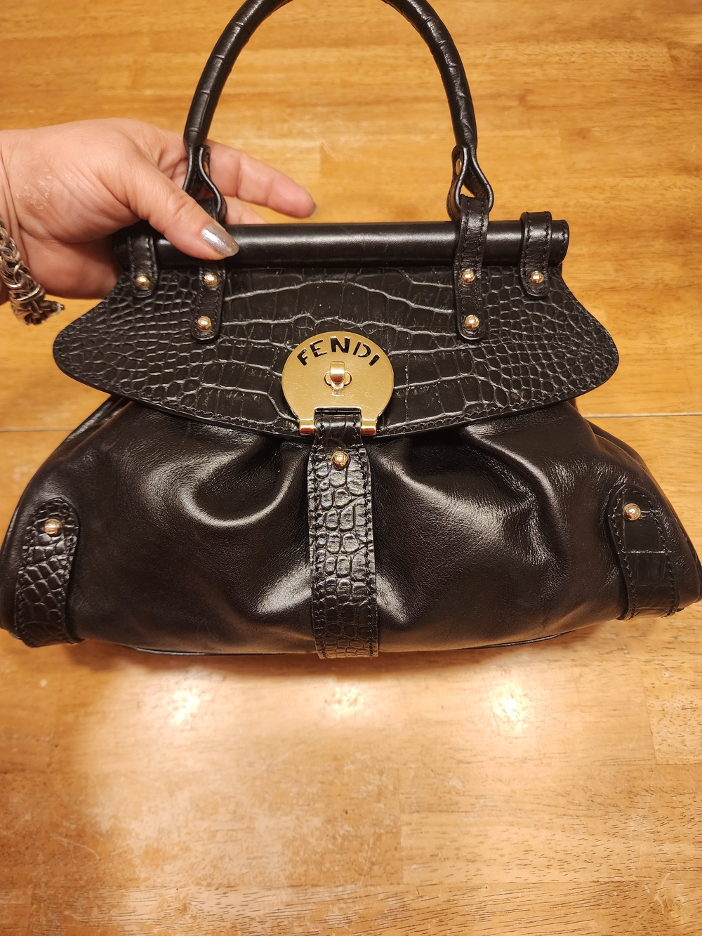 vintage Fendi Magic handbag in black leather a prominent gold-tone Logo